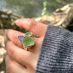 Colors 0f Nature!! Unique And Handmade!! Avai This Has Amethyst! This Has Peridot! This Has 925 Sterling Silver! Gorgeous 925 Sterling Silver Ring For Women/Girls! Product Detail: Product: Ring Gemstone Used: Trillion Shape Amethyst(66mm), Peridot Past Shape(74mm) And A Rough Of Moldavite Set In Bezel. Total Weight: 8.54 Gm Metal: 925 Sterling Silver (Stamped For Its Purity). Ring Size: Us 7 But Can Be Customized To Size 8,9 Green Amethyst Ring Fine Jewelry, Green Amethyst Multi-stone Jewelry, Green Multi-stone Amethyst Jewelry, Green Sterling Silver Gemstones With Accent Stones, Peridot Ring Gemstone Gift, Peridot Gemstone Ring Gift, Fusion Style Peridot Gemstone Jewelry, Silver Peridot Gemstone Ring, Silver Peridot Ring Gemstones