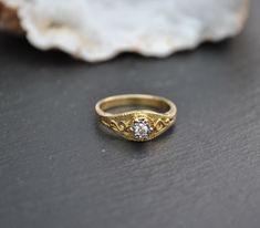 This listing is for a vintage ring 18ct gold Set with a diamond With markings to inside of the band Measurements approximately 17mms wide internally This converts to a size UK N or USA 6 1/2 In very good condition, comes with general signs of age The item is vintage, it comes with a previous life and shows this with signs of general age, use or display. See photos for an accurate likeness, more photos or measurements can be provided on request Would make a great gift, or add to your own collecti Gold Heirloom Topaz Ring With Brilliant Cut, Victorian Single Diamond Promise Ring, Antique Gold Signet Ring With Brilliant Cut, Vintage Yellow Gold Cubic Zirconia Ring, Gold Heirloom Birthstone Ring With Brilliant Cut, Gold Engraved Ring With Single Diamond, Heirloom Gold Birthstone Ring With Brilliant Cut, Victorian Gold Diamond Ring With Brilliant Cut, Gold Engraved Ring With Single Diamond, Round Band