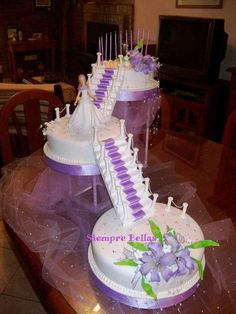 two tiered wedding cake with purple and white decorations