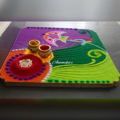 a decorated tray with two candles on it