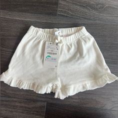 White Ruffle Hem Shorts - Never Worn Cute Zara Bottoms For Summer, Cute Ruffled Bottoms For Playwear, White Bloomers With Elastic Waistband For Spring, Cute Zara Bottoms For Spring, Casual Ruffle Bottoms For Playwear, Casual Ruffled Bottoms For Playtime, Casual Ruffled Bottoms For Playwear, Zara Casual Bottoms With Ruffles, Cute White Bottoms With Elastic Waistband