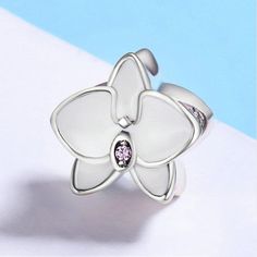 White Flower Butterfly Orchid with enamel white 100% 925 Sterling Silver Charms Fits Bracelet European & Pandora bracelet Charm Bracelet Item specifics Fine or Fashion: Fashion Item Type: Beads Metals Type: 925 Sterling Silver Model Number: PLC0205 Material: Metal Item Weight: 3.1g Item Shape: Moth orchid Charms: flower ------------------------------------ Shipping : 15 - 35 business days Shipping to United States via ePacket Processing Time : 1 - 5 days ------------------------------------ White Jewelry With Flower Charm And Shape, White Sterling Silver Jewelry With Flower Charm, White Flower Charm Jewelry, White Flower Charms Jewelry, White Sterling Silver Jewelry For Mother's Day, White Flower Shaped Jewelry For Mother's Day, White Flower-shaped Jewelry For Mother's Day, Elegant White Bracelets With Charms, White Flower Shaped Jewelry Gift