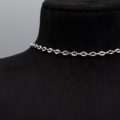 Coffee Bean Chain (Also known as the Mariner Link) A stunning minimalist stainless steel choker. 5mm x 6mm Width Stainless Coffee Bean Chain 4 Inch 4.7mm Stainless Steel Adjuster Chain Hand Made in the UK Sizing: Small 11 - 15 Inches (28cm - 38cm) Medium 13 - 17 Inches (33cm - 43cm) Large 15 - 19 Inches (38cm - 48.5cm) Modern Stainless Steel Chain Choker Necklace, Modern Stainless Steel Choker Chain Necklace, Modern Stainless Steel Chain Choker, Minimalist Stainless Steel Choker Chain Necklace, Silver Stainless Steel Oval Link Chain Necklace, Minimalist Silver Choker With Lobster Clasp, Silver Stainless Steel Choker With Clavicle Chain, Silver Link Chain Choker, Silver Oval Link Clavicle Chain Necklace