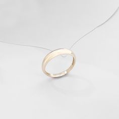 The Minimalist Dome Ring has an elegant design that its plainness is the modesty which will fascinate people around you. It is perfect for everyday use and ring stacking. - Made in 14k Solid Gold - Top Width: 4.10 mm / 0.16 inches - Thickness: 0.86 mm / 0.03 inches- Bottom Width: 2.53 mm / 0.09 inches - This product comes with iconic Norm Jewels gift box Elegant Everyday Toe Ring Stackable Rings, Elegant Everyday Stackable Toe Rings, Elegant Stackable Toe Rings For Everyday, Minimalist White Gold Dome Ring For Gift, Minimalist White Gold Dome Ring As Gift, Minimalist White Gold Dome Ring Gift, Modern Yellow Gold Midi Rings In Sterling Silver, Minimalist White Gold Dome Ring With Open Band, Classic 14k Gold Toe Ring