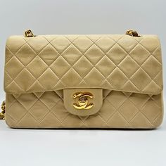 -Includes Bag And Authenticity Card -100% Guaranteed Authentic & Will Be Verified Through Poshmark Prior To Shipping To Yo -02 Series Vintage Chanel (1991-1994) -Made In France -24k Gold Plated Hardware -Adjustable Chain Strap To Wear Over The Shoulder Or Crossbody -Double Flap With Front Interior Pocket Under The Turnlock And Inner-Most Interior Pocket With The Original Lipstick Holder Design -I Don’t Believe The Bag Has Ever Been To A Spa For Retouch/Repainting *Defects* -Bag Is 30-33 Years Ol Chanel Beige, Vintage Chanel Bag, Lipstick Holder, Leather Weaving, Holder Design, Fade Color, Cc Logo, Vintage Chanel, Flap Bag