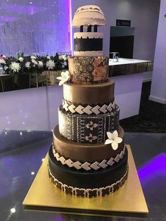 a three tiered cake sitting on top of a table