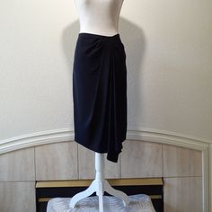 Black Crepe Like Fabric Gathered To Top Right With A Long Drape Zips At Side Gorgeous, Dress Down Or Up Excellent Condition, New With Tags Size: 10 Approx.: 16' Across At Waist / 20' Across At Hip Area / 26' Length (The Drop Is 28') Measured From Waist To Hem Black Formal Draped Skirt, Elegant Black Draped Bottoms, Black Draped Flowy Skirt, Black Draped Midi Skirt For Evening, Black Flowy Draped Skirt, Black Draped Bottoms For Evening, Black Relaxed Draped Skirt For Formal Occasions, Black Formal Relaxed Draped Skirt, Formal Black Relaxed Draped Skirt