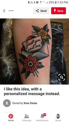 a tattoo with an envelope and flowers on it