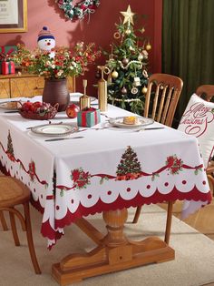 a dining room table with christmas decorations on it