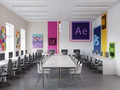 an office with multiple desks and chairs in front of colorful art on the walls