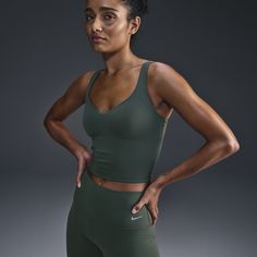 Move effortlessly from your morning walk to all the activities that follow in this stretchy, sweat-wicking tank top that feels like a second skin. The fully sewn-in bra helps resist shifting and offers medium support that gives you a snug hold, helping keep everything in place. Sporty Tank Activewear With Built-in Bra, Sportswear Tank Top With Built-in Bra For Training, Nike Yoga Sports Bra With Built-in Bra, Nike Sports Bra With Built-in Bra For Yoga, Green Tank Sports Bra Athleisure Style, Athleisure Tank Top With Built-in Bra And Medium Support, Green Compressive Sleeveless Sports Bra, Sporty Green Tops With Built-in Bra, Green Compressive Activewear With Medium Bust Support