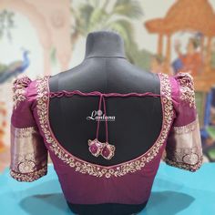 Discover this gorgeous purple silk blouse, adorned with intricate gold embroidery and unique tassel detailing. Perfect for bridal and party wear,thread work zari and zardosi, this elegant design features puff sleeves and a stunning back pattern. Ideal for those searching for stylish saree blouses, bridal blouses, or party wear blouses. Elevate your traditional look with this exquisite piece!" Back Neck Designs For Blouses Traditional, Purple Blouse Work Designs Pattu, Purple Bridal Blouse Designs, Simple Zardosi Work Blouse Designs, Plain Pattu Blouse Design Models, Purple Bridal Saree, Embroidery Blouse Designs Thread, Latkan Tassels Blouses, Silk Sarees Blouse Designs