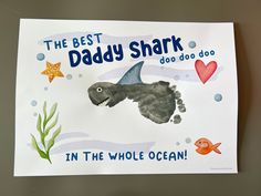 the best daddy shark in the whole ocean card is made with watercolors and paper