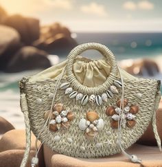 This elegant beach handbag is perfect for an outfit or to go out for dinner. You will get many compliments.  Great for gift giving  It is 100% handmade. Straw material Comes with a removable chain. Size  Bag Length:13 inch, Bag Width:3.1 inch, Bag Height:8.3 inch, Handle Height:3.9 inch, Strap Length:47.2 Summer Sand-colored Straw Bag, Summer Beach Bags Made Of Shell, Sand-colored Straw Bag For Summer Beach, Summer Tote Bag Fashion Accessory, Summer Beach Shoulder Bag Made From Palm Leaf, Woven Bags As Fashion Accessories For Summer, Summer Beige Bags As Fashion Accessory, Beachy Sand-colored Straw Bag, Beige Summer Fashion Bag