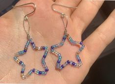 These cute blue star danglies would be an excellent pair of earrings for a night out or a great way to spice up a casual outfit to work!  Sterling silver hooks, glass beads.  Check out my custom star earring listing if you love the style but want to change the color or size! And, as always if you have any questions feel free to message me!  Thanks for stopping by ✨  Xx, Ree Star Aesthetic, Star Dangle Earrings, Star Earring, Bead Charms Diy, Handmade Jewelry Tutorials, Handmade Wire Jewelry, Funky Jewelry, Diy Crafts Jewelry, Bijoux Diy