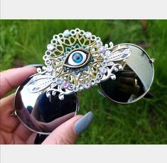 💙A great funky pair of sunglasses suitable for the festival girls and boys.... 💜This trippy pair of Third Eye Sunglasses are the perfect unusual accessory if you love something different. 💙The frames are silver lightweight and they have silver  mirrored lenses. In the centre of the glasses they have hand painted boho psychedelic metal embellishment in silver, gold and blue, iridescent ab rhinestones with a 'all seeing' third eye in the centre. 💜Great for festivals, carnivals, holidays, or everyday wear if that's your thing 😉 💙UV protection. 💜Exclusive design made by myself, you won't see any others like these anywhere else. 💙All my glasses come in a black pouch to keep them safe, please also handle with care. 💜Checkout the full collection of Sunglasses here :  https://www.etsy.com Third Eye Sunglasses, Funky Clothing, Festival Girls, Eye Round, Brown Accessories, Black Jewel, Funky Outfits, Unisex Sunglasses, Accessories Sunglasses