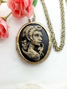 JUST LISTED Athena Tattoo Lady Goth Rockabilly Antique Gold Locket Cameo Necklace Pendant Victorian Jewelry substantial in size at just a little over 2 INCHES Long Center is 40mmx30mm **MATCHING ITEMS IN OUR STORE BADGE HOLDER BROOCH HAIR PINS - CLIPS** **thank you for taking the time to look at our items. Each item is handcrafted and attention to detail - We send each item in bubble packaging and with tracking to make sure items arrive in perfect condition. Thanks again.**IF YOU NEED MORE LET M Rockabilly Earrings, Antique Gold Locket, Athena Tattoo, Goth Rockabilly, Bubble Packaging, Gold Locket, Cameo Necklace, Black Skulls, Black Chain