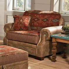 a living room with a couch and ottoman