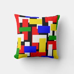 a colorful pillow on top of a white wall