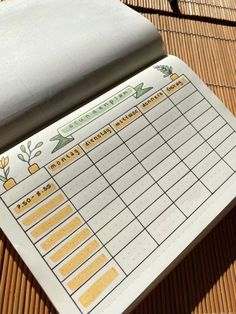 a notepad sitting on top of a wooden table