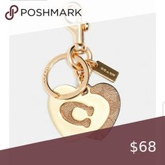 a gold heart shaped keychain with the number six on it