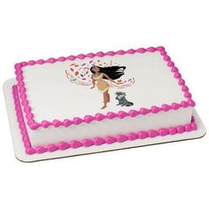 a white cake with pink frosting and a cartoon character on it