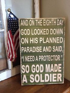 a wooden sign that says and on the eighth day god looked down on his planned paradise and said i need a protector so god made a soldier