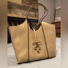 Brand New With Tag. Never Used. Comes With Dust Bag. I Purchased It Last October But Haven’t Got Any Chance To Carry It Yet. More Product Details Can Be Found On Tod’s Official Website Https://Www.Tods.Com/Us-En/T-Timeless-Shopping-Bag-In-Leather-Small/P/Xbwtsba0200q8ec803/ Chic Beige Bag With Palladium Hardware, Beige Shopping Bags With Palladium Hardware, Elegant Tan Shoulder Bag With Dust Bag, Elegant Tan Tote Shoulder Bag, Elegant Tan Shoulder Bag With Handles, Elegant Tan Shoulder Bag, Gold Tote Bag With Palladium Hardware, Gold Shoulder Bag With Palladium Hardware, Everyday Tan Bag With Palladium Hardware