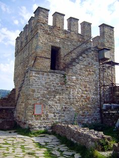 an old castle with stone walls and towers