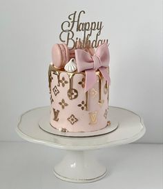 a birthday cake with pink and gold decorations