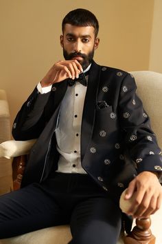 Black tuxedo with floral embroidered motifs. Paired with shirt, bow tie, pocket square and pant.
Component: 5
Pattern: Embroidered
Type Of Work: Floral
Neckline: Shawl Lapel
Sleeve Type: Full
Fabric: Italian Suiting
Color: Black
Other Details: 
Weight (in gm): 800
Floral motifs
Occasion: Cocktail - Aza Fashions Square Composition, Stylish Kurta, Blue Tuxedo, Blue Tuxedos, Tuxedo Shirt, Classic White Shirt, Square Pants, Tuxedo Pants, Indian Wedding Wear