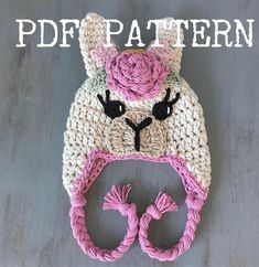 a crocheted hat with a pink flower on top and the words pdf pattern above it