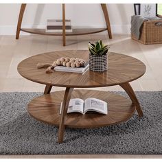 two wooden tables with books on them in a living room next to a couch and coffee table