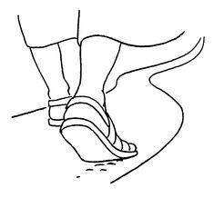 the feet and ankles of a person wearing sandals