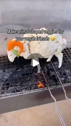 an animal made out of vegetables on top of a grill with the words make animal shaped veggies for your vegan friends