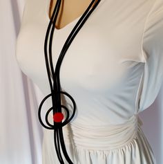 This Necklace Is Absolutely Stunning Handmade Super Light And Delicate Made With Rubber And Red Wooden Beads Hangs 28 Inches A Statement Piece So Unique And Eye Catching Picasso Vibes Are All Over This Necklace One Of A Kind Piece. Handmade Circular Black Necklaces, Handmade Circular Black Necklace, Handmade Black Circle Necklaces, Handmade Black Circle Necklace, Black Lariat Long Necklace Gift, Black Lariat Long Necklace For Gift, Elegant Handmade Red Long Necklace, Black Long Necklace Gift, Handmade Black Circular Jewelry