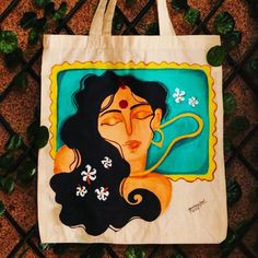 a tote bag with an image of a woman's face on it