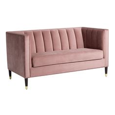 a pink velvet couch with gold legs