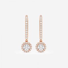 Drop it like it's hot with these sizzling round halo drop earrings made with our finest lab grown diamonds. Each large round diamond is encircled with smaller star-like diamonds to give this beautiful halo effect. Made with lever back posts that slip on easily and securely. It can't get hotter than this! Rose Gold Round Diamond Earrings With Halo Design, Rose Gold Diamond Earrings With Halo, Rose Gold Halo Earrings With Cubic Zirconia, Rose Gold Round Halo Diamond Earrings, Formal Rose Gold Halo Diamond Earrings, Rose Gold Diamond Halo Earrings, Round Rose Gold Earrings With Halo Setting, Get Hotter, Halo Effect