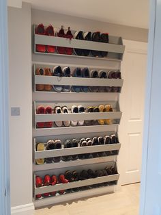 there are many pairs of shoes on the shelves