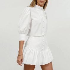 This Women's Summer Cotton Linen White Mandarin Collar 3/4 Sleeve Blouse and High Waist Tight Skirt Set is made from 100% cotton, ensuring softness, comfort, and skin-friendliness. The simple white Mandarin collar blouse pairs perfectly with the high-waisted tight skirt, featuring a playful pleated hem that adds a touch of fashion and charm. This set is ideal for daily wear, commuting, festivals, Valentine's Day, and weddings, offering a perfect blend of elegance and style. Summer Jewelry Trends, Mini Rock, Rock Outfit, Stil Elegant, Linen White, Casual Skirt, Lantern Sleeve, Short Skirt, Summer Cotton