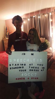 a man and woman standing next to each other holding a sign that says i'd be speciales starting at you standing there in your dress at