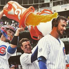 the chicago cubs are celebrating their win over the san francisco giants at wrebling field