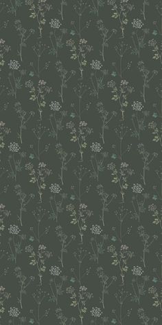 a green wallpaper with small flowers and leaves on the bottom half of it, against a dark background