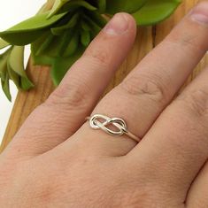 This Infinity Knot Ring is a dainty ring that shows your forever love, friendship, and appreciation for a special someone whether it be a wife, girlfriend, daughter, sister, or best friend. Solid Sterling Silver Infinity Knot Ring Band just over 1mm thick