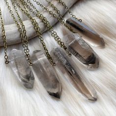 Make this eye-catching raw phantom quartz necklace your newest wardrobe staple! Bold yet simple, this versatile raw crystal necklace will go with almost anything in your closet! ✧ Brazilian quartz point with manganese inclusions ✧ 100% natural raw crystal, not shaped or treated ✧ Crystal size 25-50mm long (1-2 inches) ✧ Select your favorite crystal from the dropdown menu ✧ Antique brass chain in your chosen length ✧ Hypoallergenic metals upon request ✧ Sterling silver available for additional fe Crystal Point Necklace, Talisman Jewelry, Talisman Necklace, Raw Crystal Necklace, Raw Quartz, Quartz Crystal Necklace, Phantom Quartz, Necklace Boho, Clear Quartz Crystal