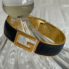 Gucci Black Python Gold Fashion Bangle/Bracelet Vintage Jewelry. Beautiful. Good Condition. Normal Wear & Tear. Has Slight Scratches, Throughout, On The Gold Areas. Python Skin Is Intact. Spring Hinge, Works Good. No Tarnishing. Size: 2 5/8” Length Est 2” Width Est 5/8” Band Width Est It Has Been Authenticated By Realauthentication.Com, One Of Poshmarks Approved Vendors. Does Not Come With Original Box. You Will Get A Box And Little Satchel. Not Gucci Package. Sorry. Luxury Cuff Bracelet For Formal Occasions, Elegant Gucci Bracelets For Formal Occasions, Designer Cuff Bracelet Bangle For Evening, Elegant Gucci Formal Bracelets, Designer Black Bracelets For Party, Designer Black Bracelet For Party, Designer Black Party Bracelets, Classic Gucci Bangle Bracelets, Gucci Classic Yellow Gold Bracelet