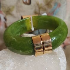 This Listing Is For A Pink Linen Brand, Olive Green Marbled, Hinged, Bangle Bracelet. If You Love Vintage Jewelry, But Prefer Pristine Pieces Without Wear, This Is For You. This Is Brand New, Never Worn. The Marbling Is Fabulous, And The Lucite Is Slightly Transparent When Held Up To The Light. The Gold Tone Hardware Is Shiny And The Magnetic Closure Is Tight, And Lines Up Evenly. The Spring Is In Perfect Working Order. The Inner Measurement Is Approximately 2 3/8". As You Can See, It Is An Oval Lucite Jewelry, Magnetic Jewelry, Hinged Bracelet, Love Vintage, Pink Linen, Marbling, Hinged Bangle, Green Gold, Magnetic Closure