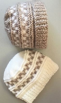 two knitted hats sitting next to each other