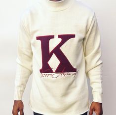 Exclusive Kappa Alpha Psi Chenille Appliqué Embroidery Crimson Sweater. This is the perfect long-sleeved Sweater to wear while showing off your Kappa Alpha Psi fraternity . A comfortable 100% Acrylic with a Chenille K diamond and Kappa Alpha Psi embroidery across the chest give you the perfect fit. This sweater is also a perfect gift for your favorite Kappa Man. Fast Shipping & Processing: 1-2 days to process US Domestic Shipping: 3-5 business days International Shipping: 7-14 business White Embroidered Logo Sweater For Fall, Long Sleeve Sweater With Embroidered Logo For Winter, Long Sleeve Tops With Embroidered Logo For Fall, Fall Tops With Embroidered Logo And Long Sleeves, Winter Sweater With Embroidered Graphics, Fall Long Sleeve Tops With Embroidered Logo, Winter Long Sleeve Sweater With Embroidered Graphics, White Long Sleeve Sweater With Embroidered Logo, Fitted Long Sleeve Tops With Embroidered Graphics